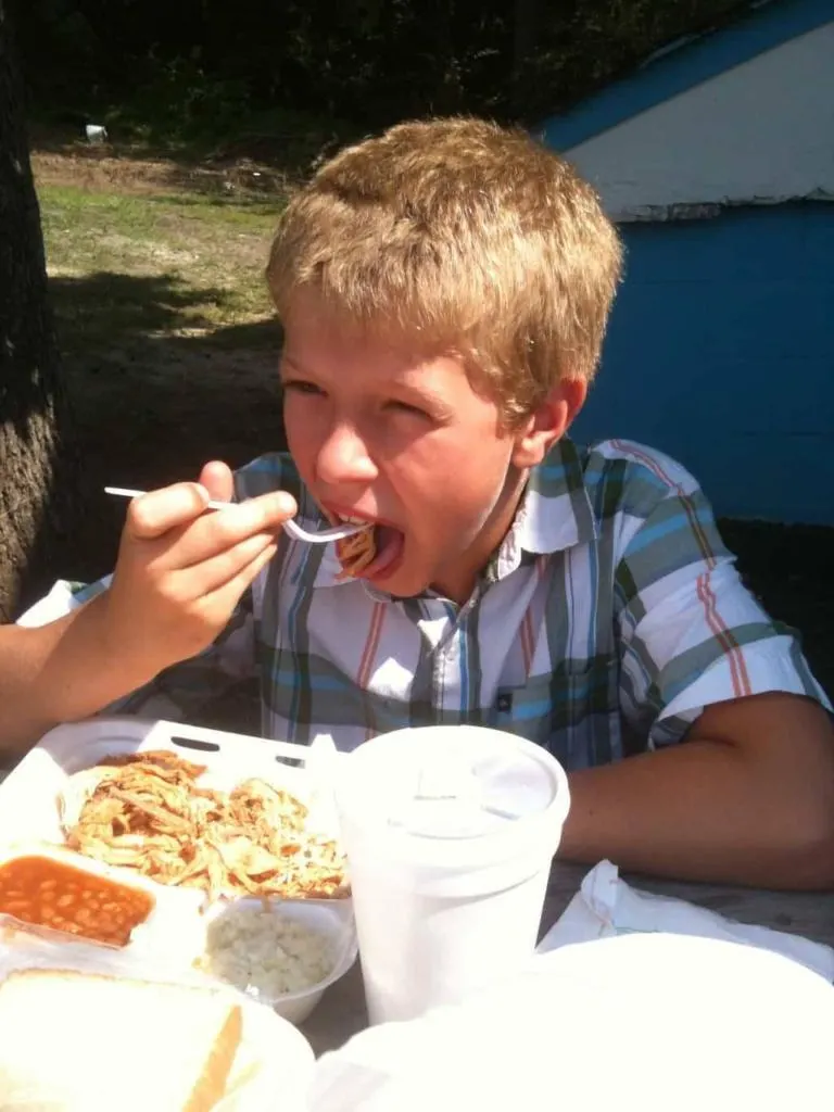 Scott's BBQ, Hemingway, SC Camden takes a bite of Scott's BBQ.