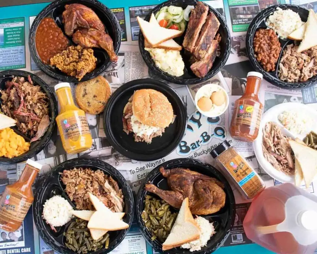 Table full of all the meats and sides served at Bucky's BBQ.