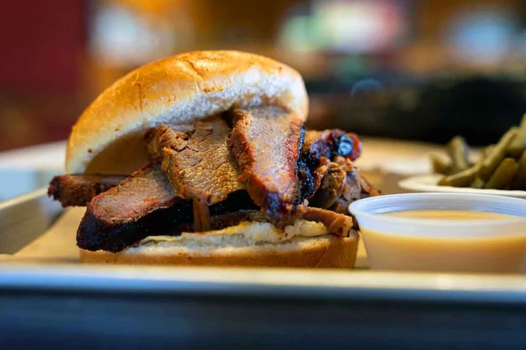 Brisket slices on a bun.