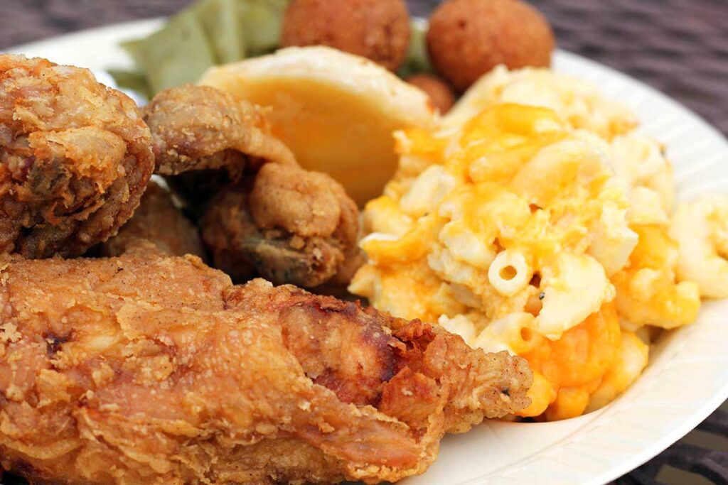 Closeup of plate of fried chicken with sides.
