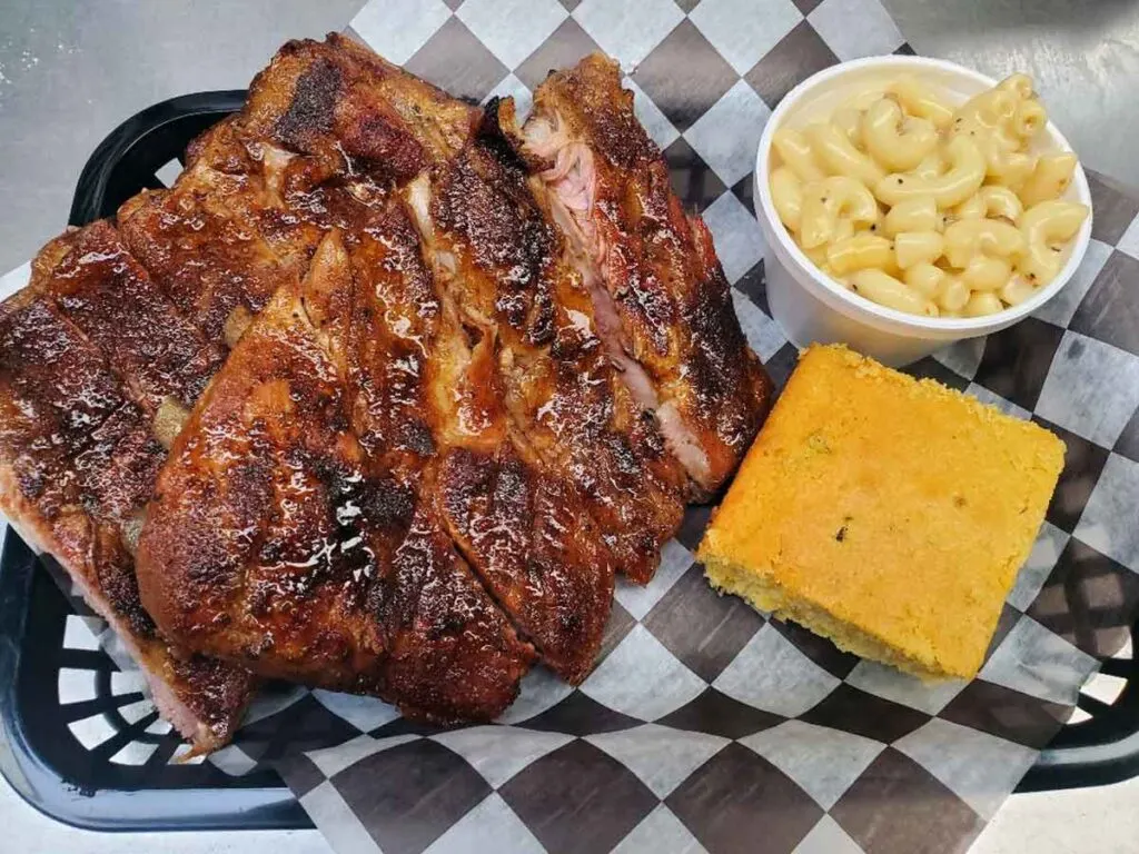 Slab of ribs with Mac and cheese and cornbread.