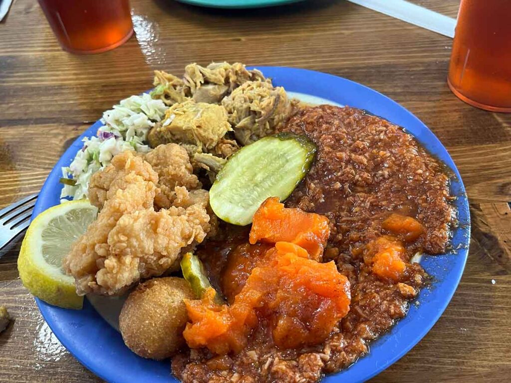 Barbecue plate with hash and sides.