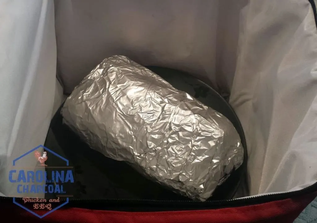 Foil wrapped butt goes into cooler; cover with a towel
