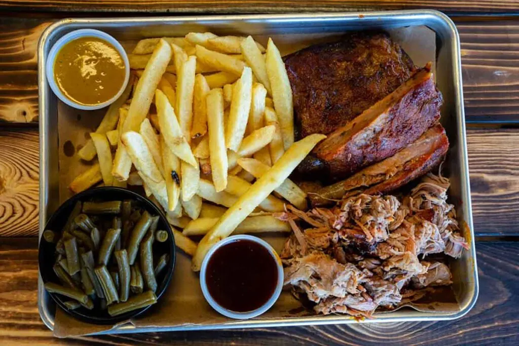 Ribs and pulled pork with sides.