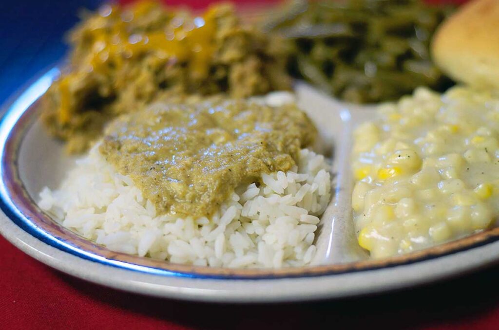 Closeup of a plate with hash and rice in focus
