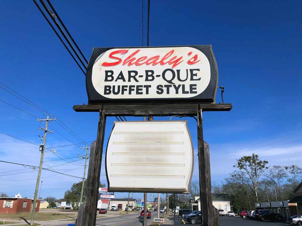 Shealy's BBQ sign against a blue sky