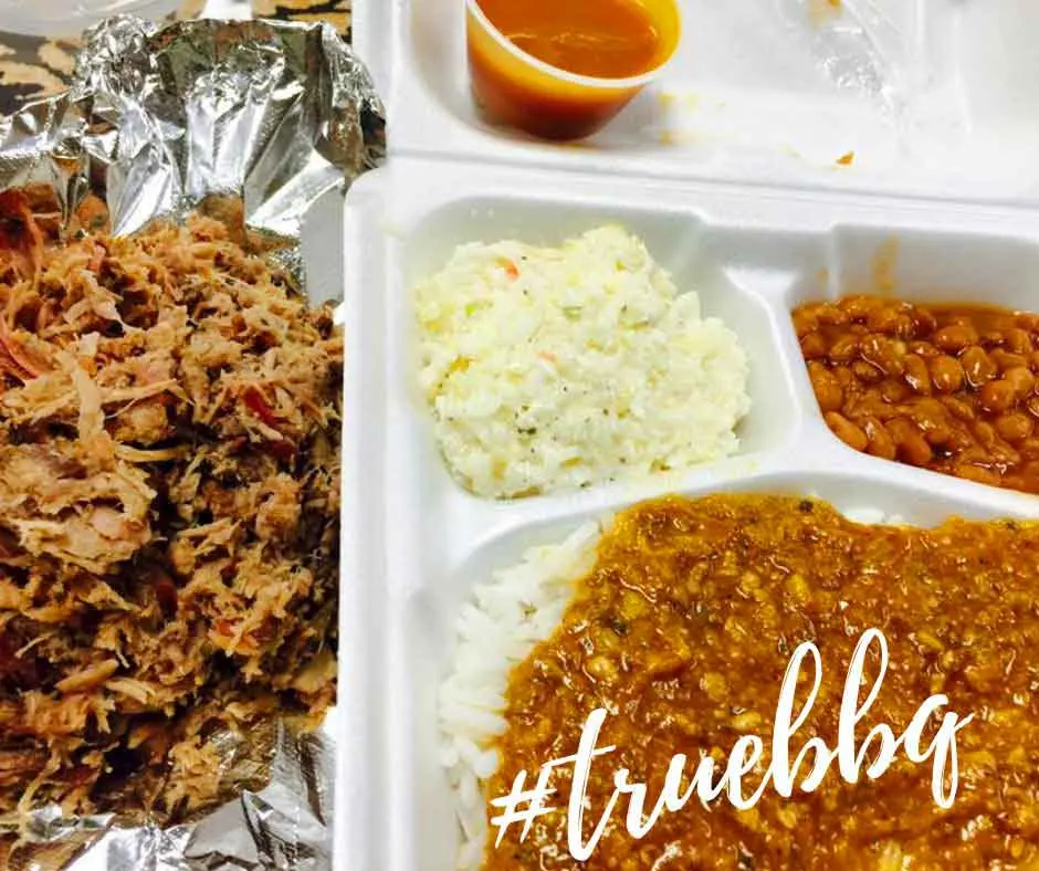 Takeout BBQ plate with BBQ, hash, slaw, and baked beans