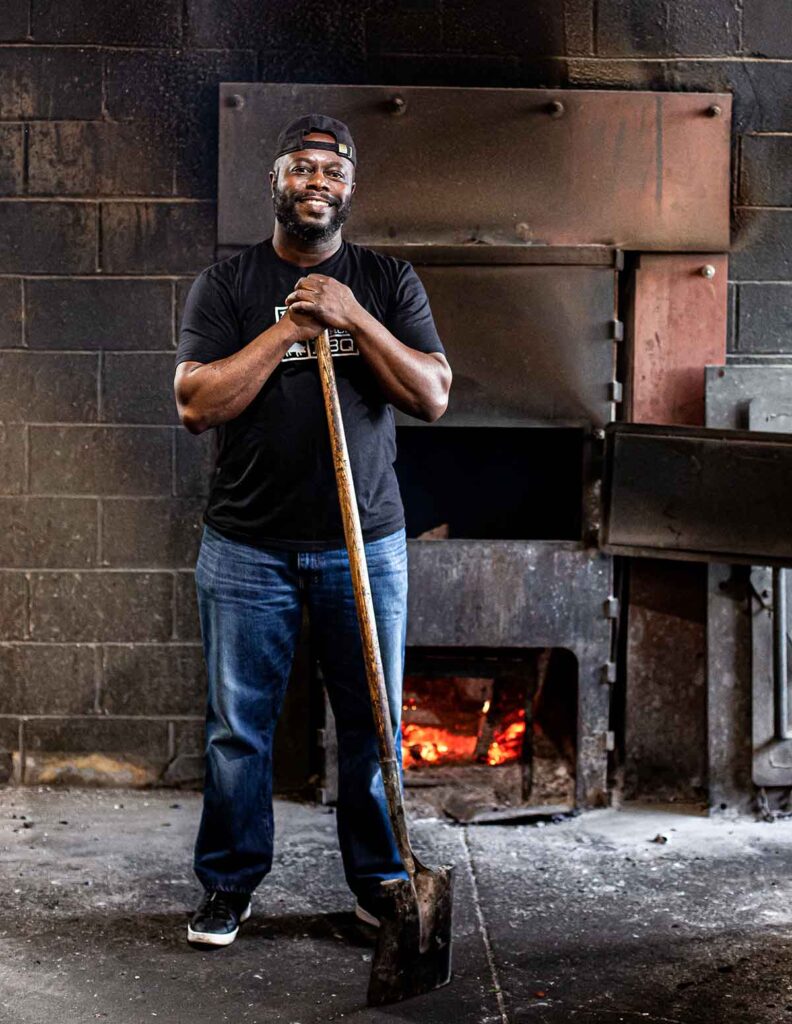 Rodney Scott standing in the pit room at Rodney Scott's BBQ in Charleston.