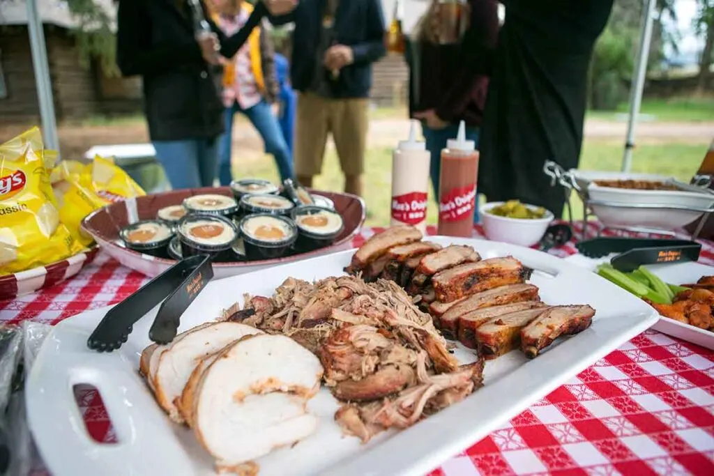 Moe's Tailgate spread with turkey, pulled pork, and ribs.