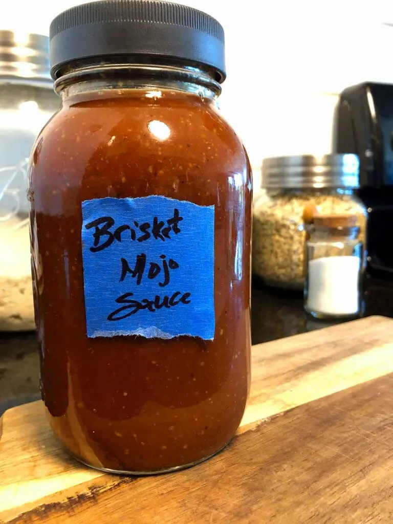 Mason jar full of brisket mojo sauce