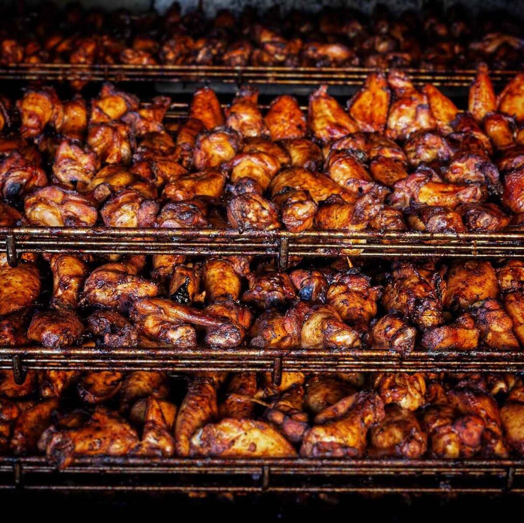 Hundreds of wings in smoker at Home Team BBQ