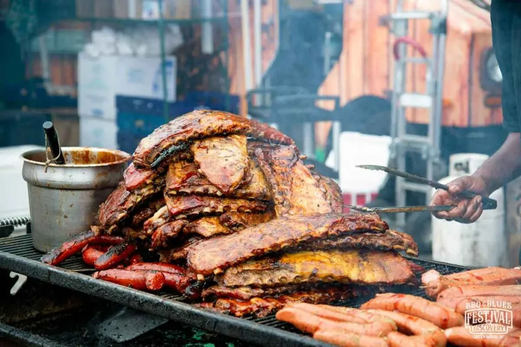 Ribs and other meats on the pit at the Festival of Discovery in Greenwood.