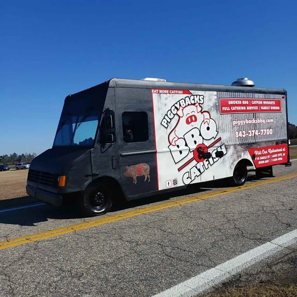 Piggyback's Food truck on road with blue sky.