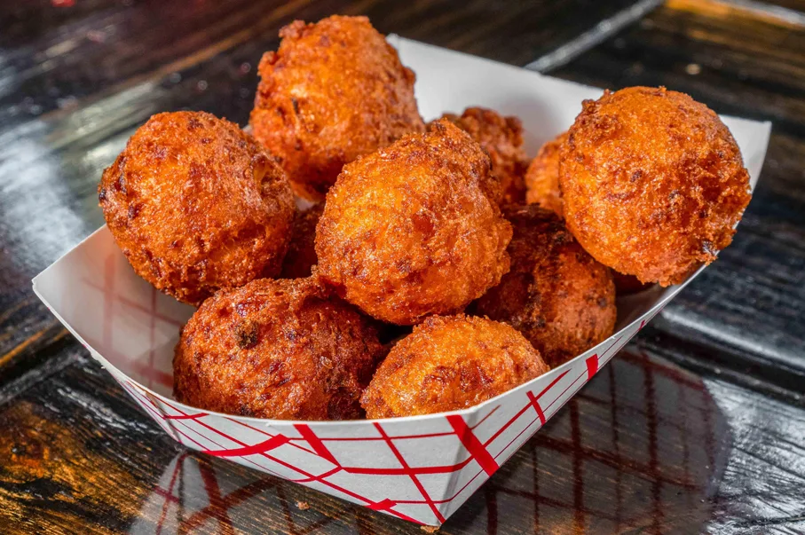 Maurice's Hush Puppies in paper tray.