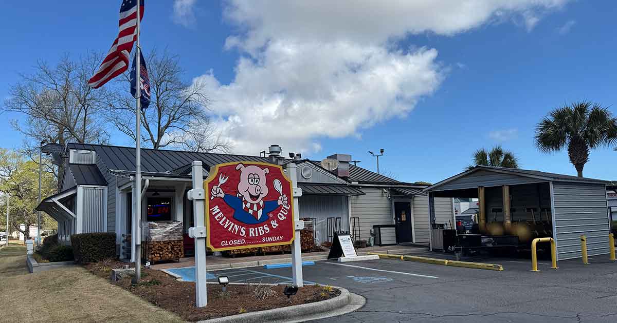 Melvin's BBQ exterior on James Island, showing the front sign and restaurant entrance.