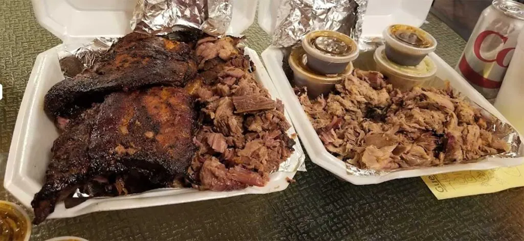 Two styrofoam trays full of BBQ