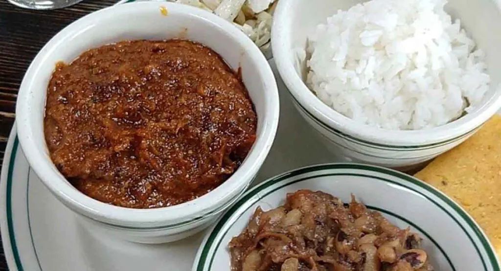 Hash, rice, and beans in separate bowls at Buxton Hall BBQ in Asheville.