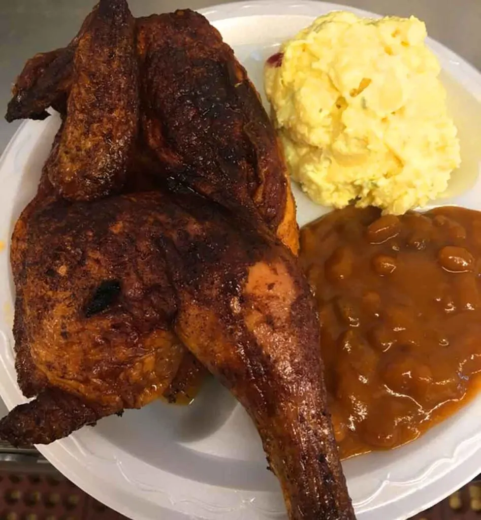 Barbecued chicken, baked bean, and potato salad