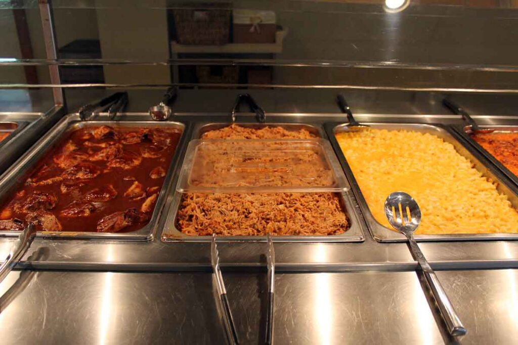Barbecue chicken, pulled pork and Mac n cheese on buffet