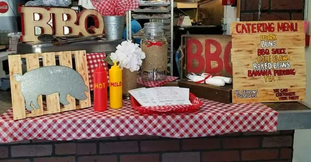Catering Menu on gingham bar with sauces and BBQ decorations