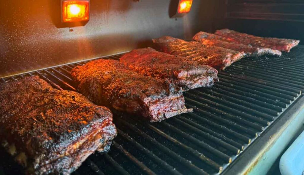 Racks of ribs on grill.