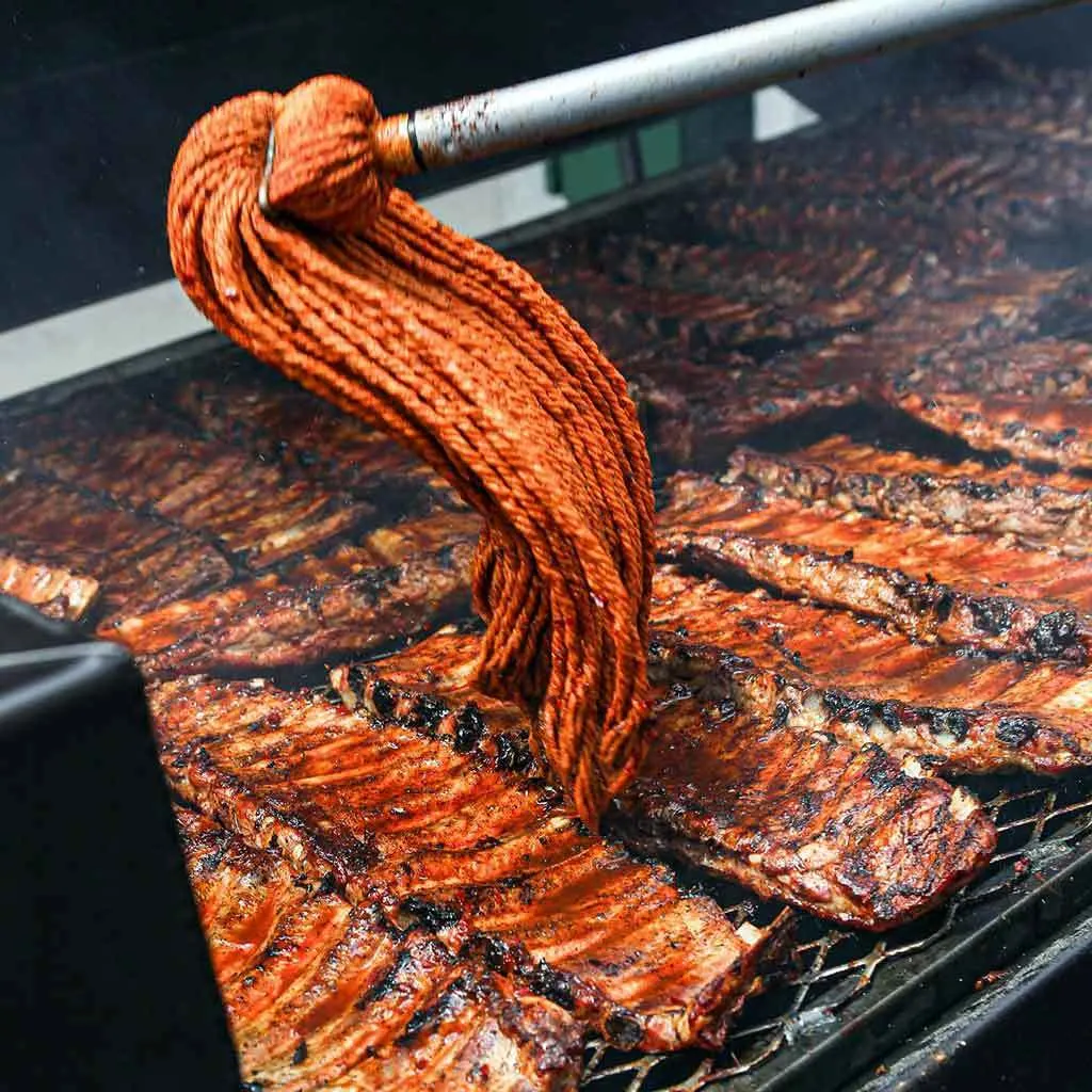 Rodney Scott mopping ribs with his signature mop