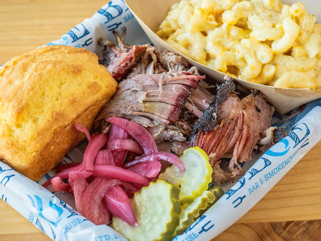 Pick one platter with pulled pork, pickles, cornbread and Mac and cheese.