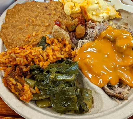 BBQ Plate with barbecue, collards, hash, and other sides at Dukes on James Island