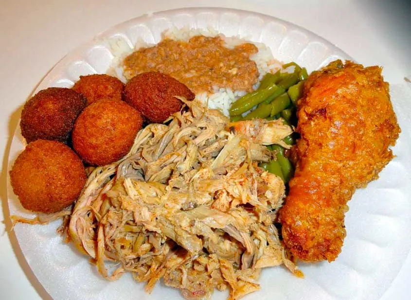 Pulled Pork, fried chicken, hush puppies, green beans and hash and rice plate.