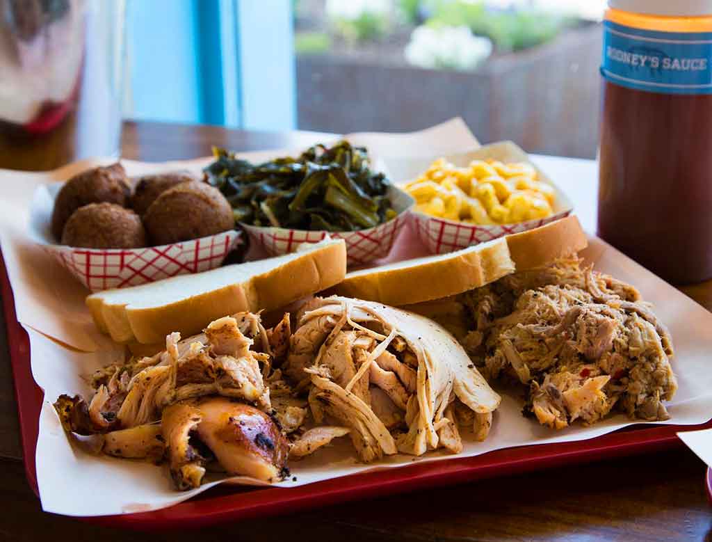 Turkey platter with smoked turkey whole hog bbq, hushpuppies, collards, and Mac n cheese.