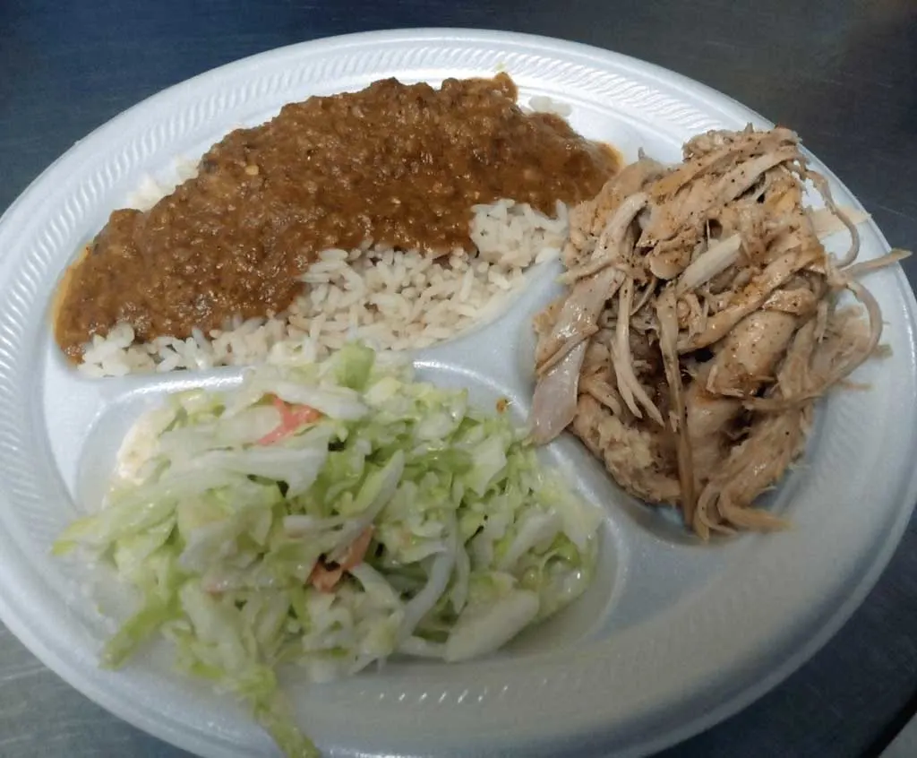 Sugar Hill BBQ plate with hash and rice, coleslaw, and pulled pork.