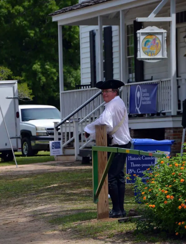 Worker at the Historic Camden site dressing in Revolutionary garb.