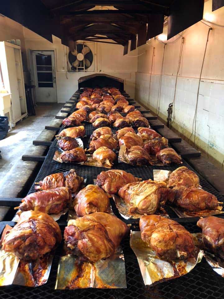 Dozens of hams on pits at Lancaster's Big Oak BBQ