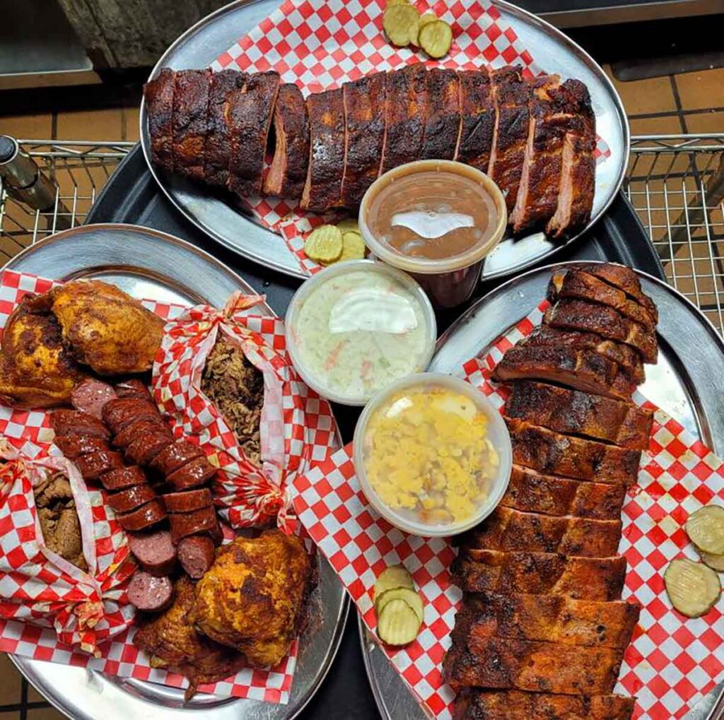 Platters of meats and sides from KC Mike's Smokin in Beaufort