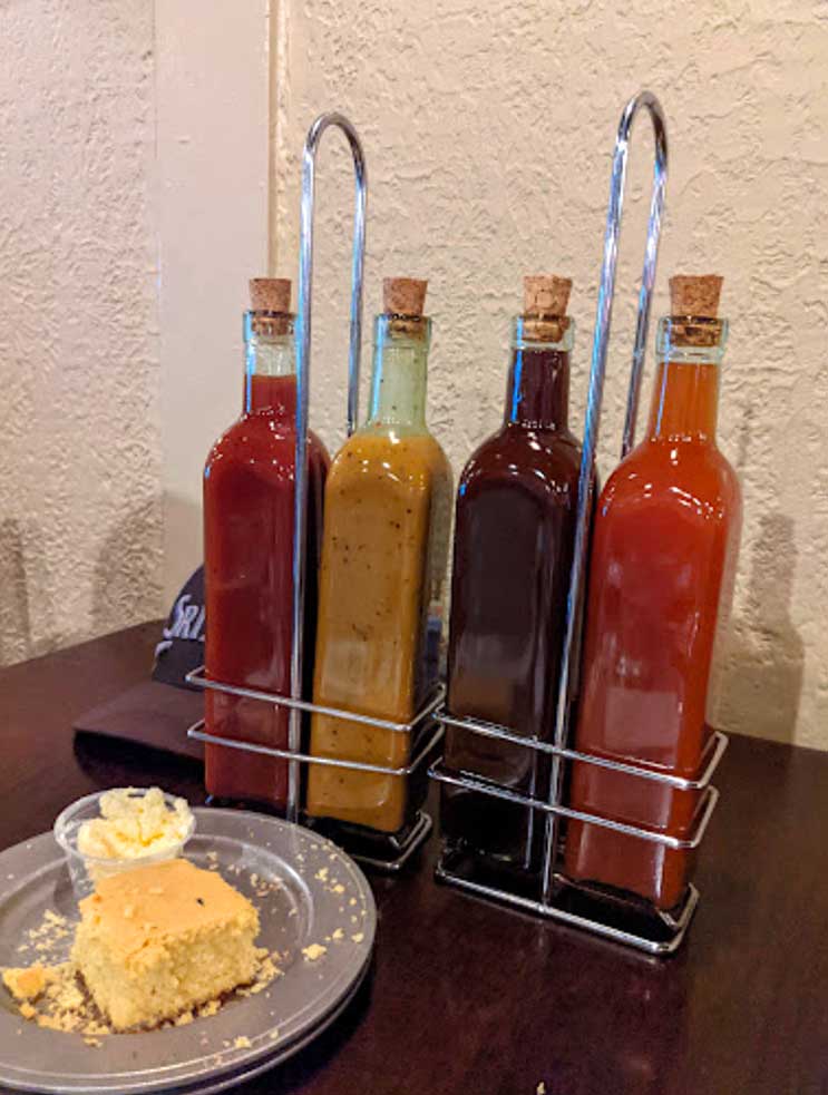 Sauces in glass bottles at Smoke on the Water