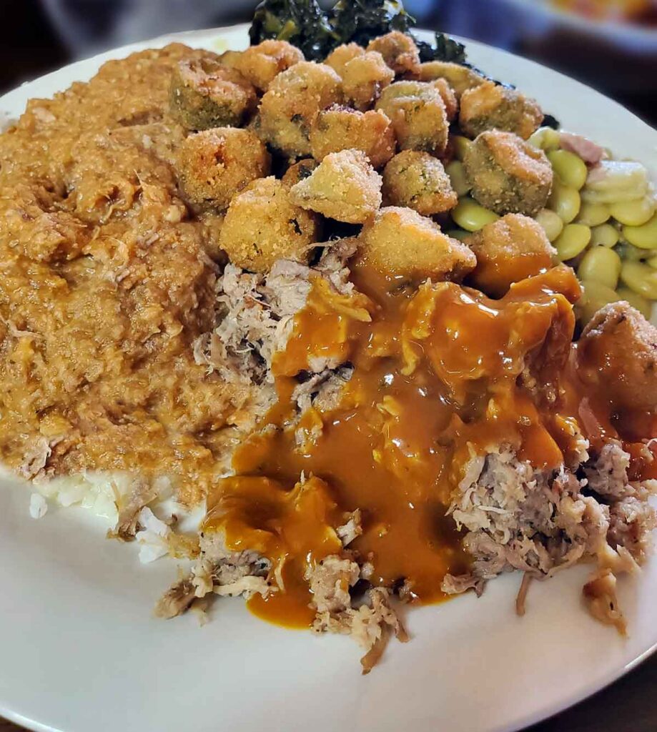 Plate of BBQ, hash, fried okra and more from Laird's