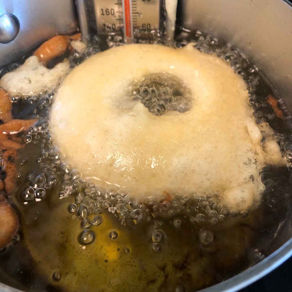 Onion ring floating in hot oil