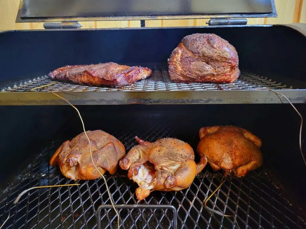 Several different meats on a smoker