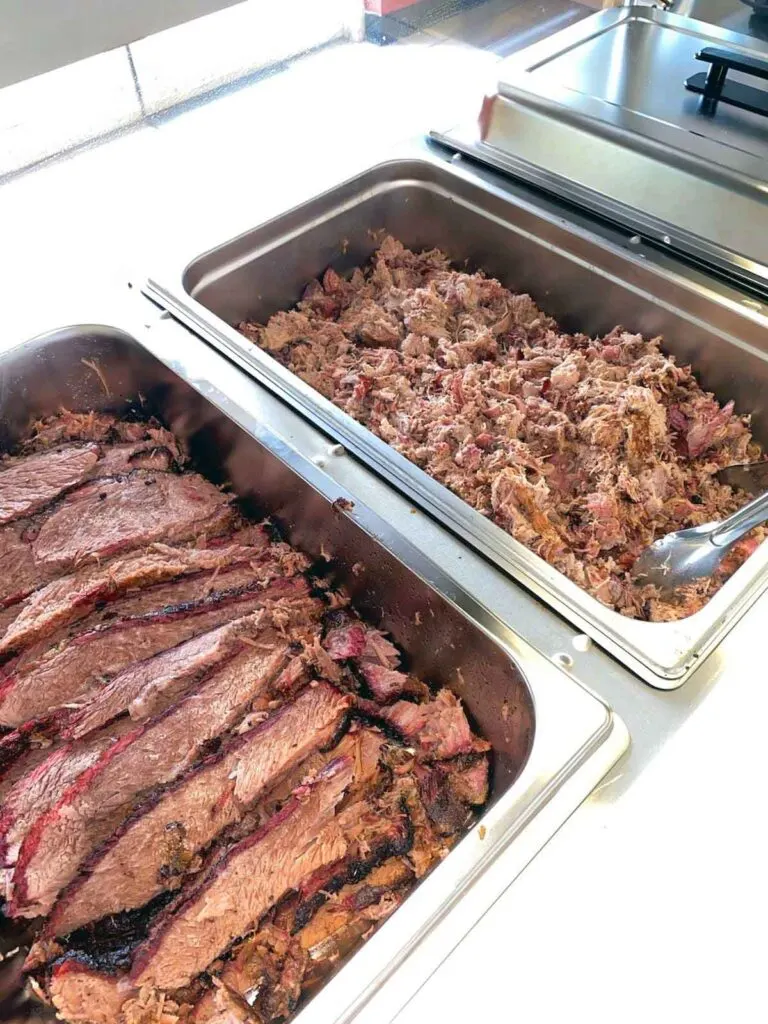 Pans of brisket and pulled pork