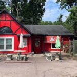 Exterior of Cox Family BBQ Building, red with black trim