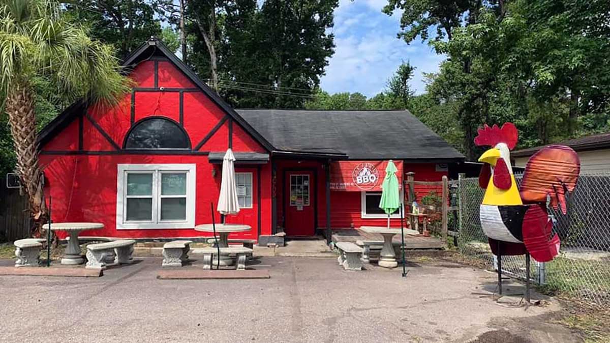 Exterior of Cox Family BBQ Building, red with black trim