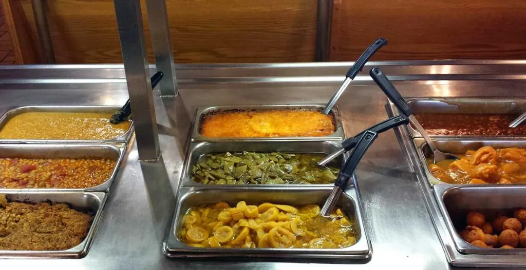 Vegetable options on buffet line.