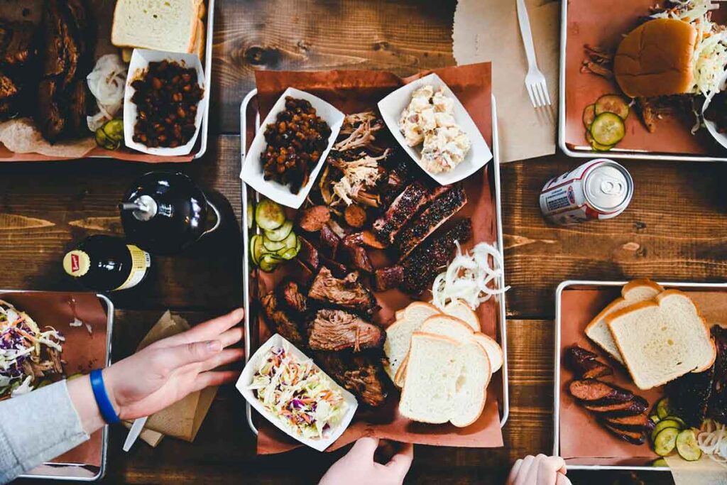 Overhead shot of table of BBQ platters