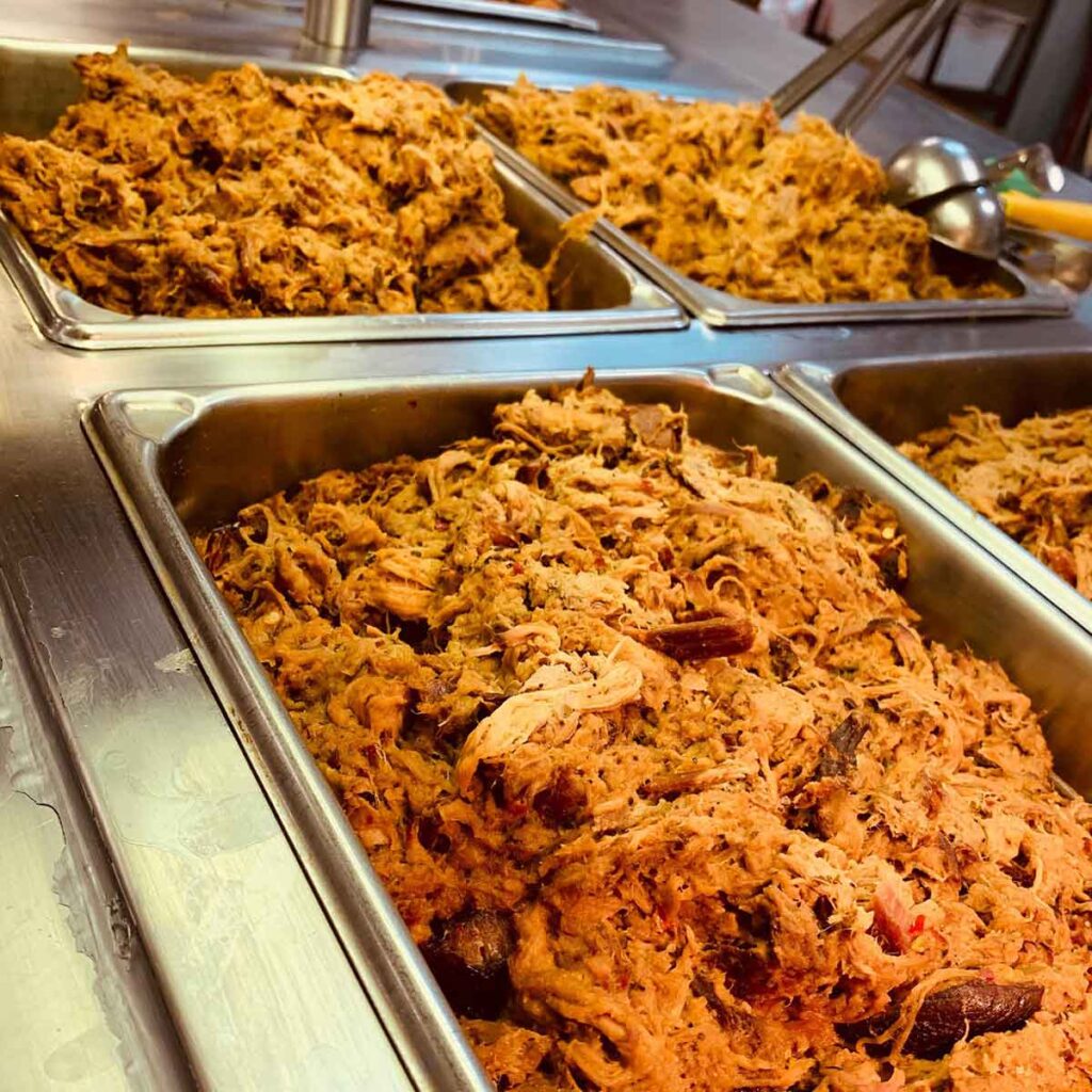 Trays of barbecue on the buffet.