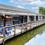 Exterior of Slowcountry BBQ on Hilton Head, deck overlooking water.