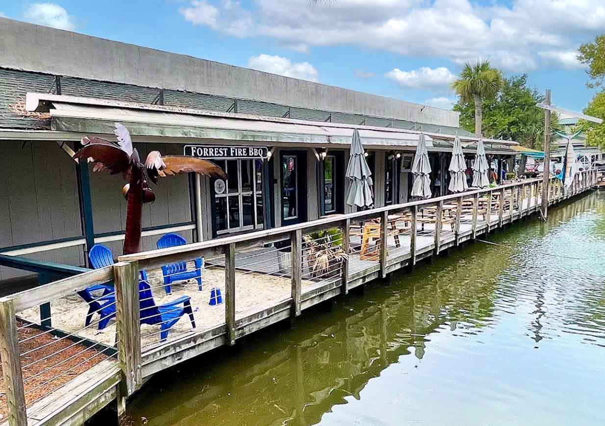 Exterior of Forrest Fire BBQ on Hilton Head, deck overlooking water.