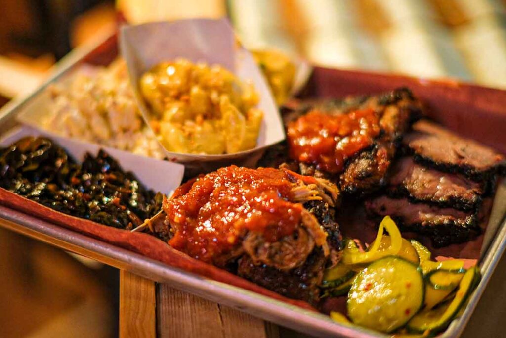 Platter with smoked meats and side.