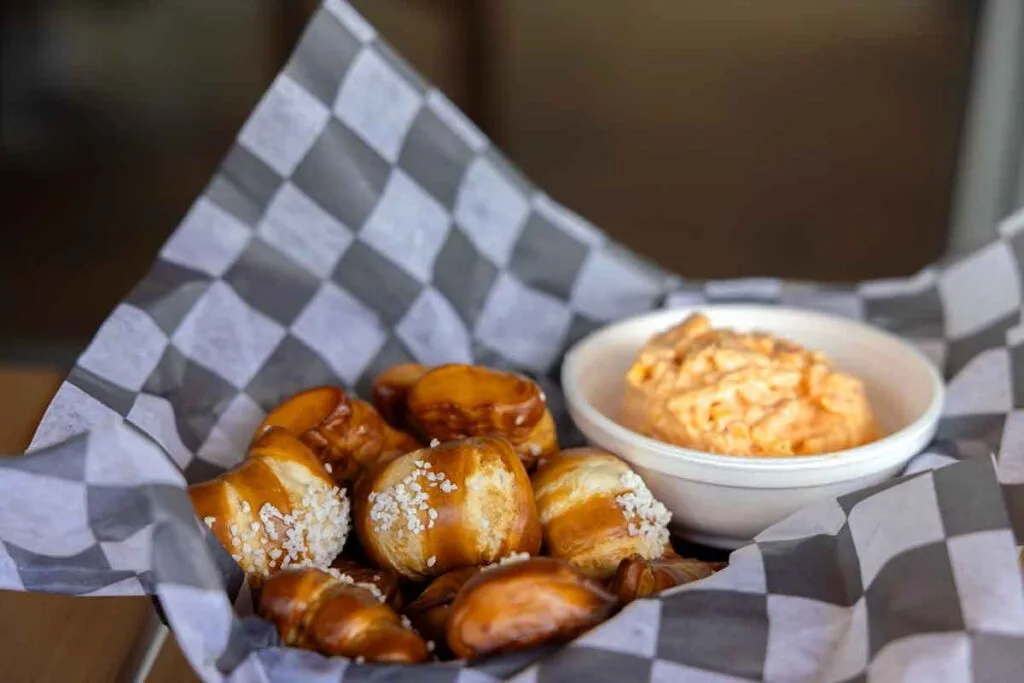 Pretzel bites in basket with pimento cheese.