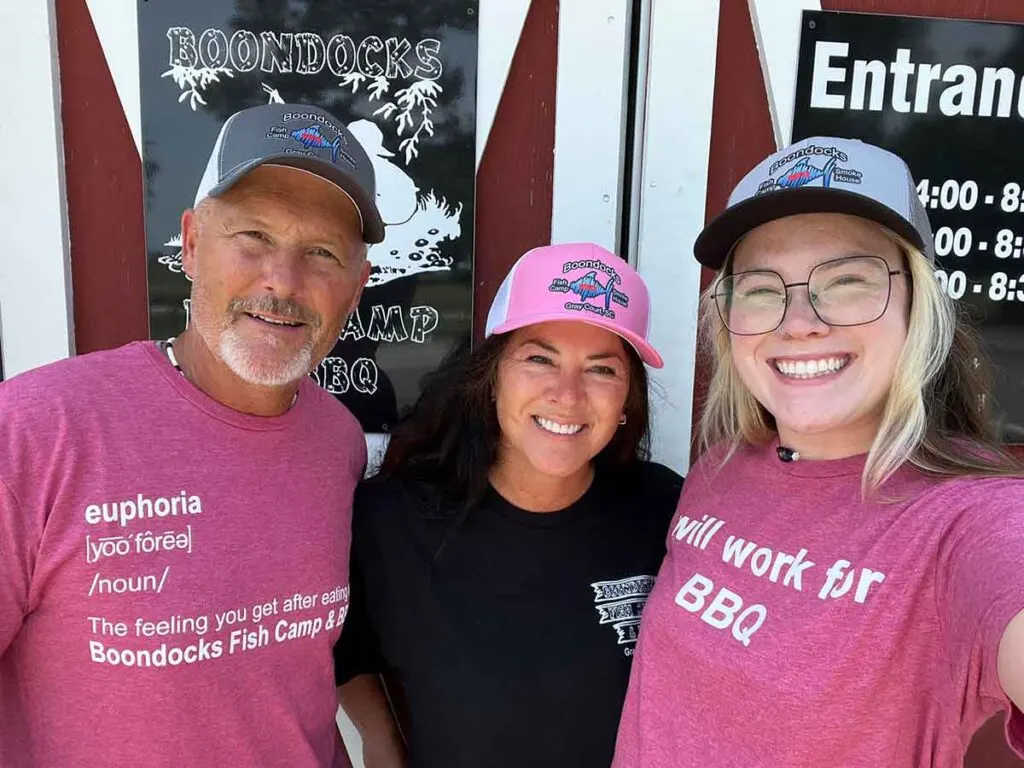 Christian and Christine Perry, owners of Boondocks, with their daughter sporting their new merchandise