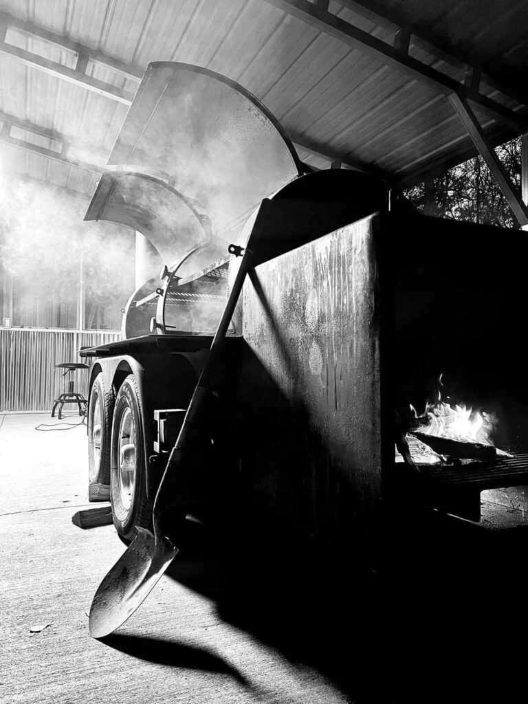 Black and white image of large smoker.